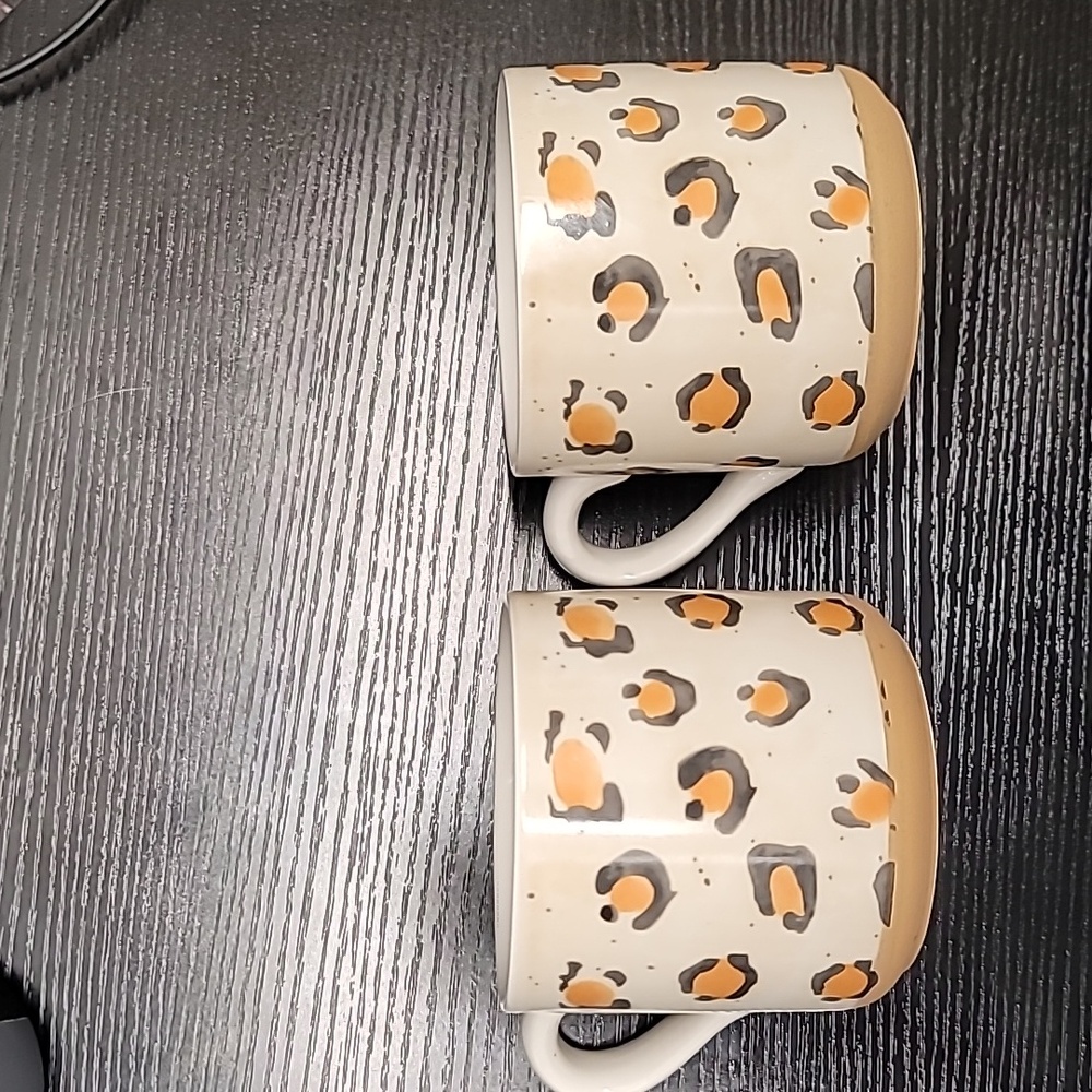 (2) Real Living mugs.